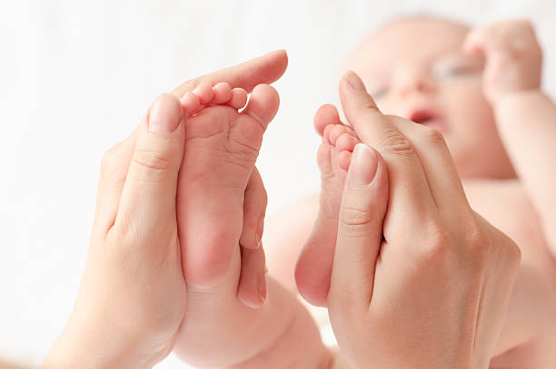 istock Baby feet close-up 513646733