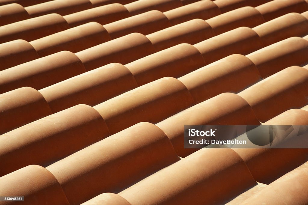 Roof Tile Repeating Pattern Terracotta roof tiles in a repeat pattern slanting across the image. Abstract Stock Photo