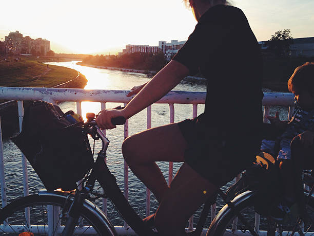 istock Mother and baby cycling together 513648399