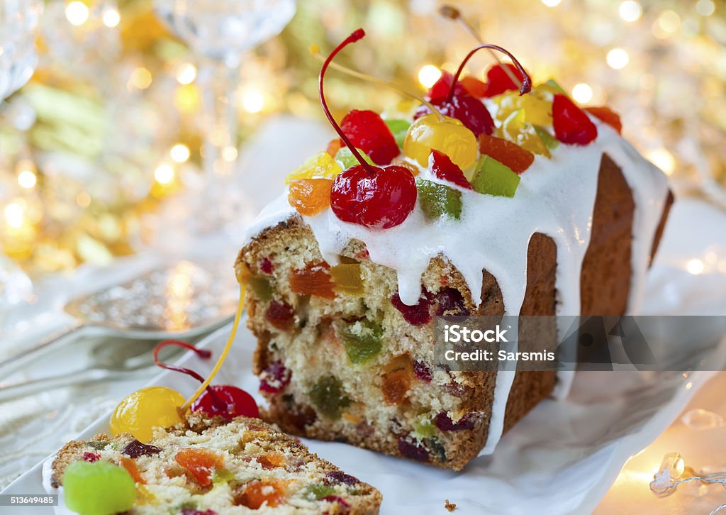 Christmas fruitcake Christmas fruitcake with sugar icing and candied fruits Fruitcake Stock Photo
