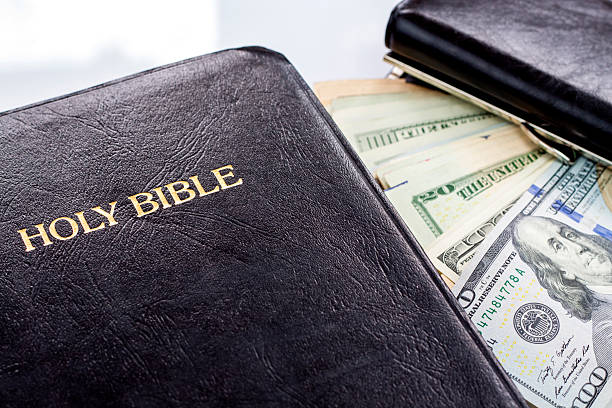 istock Holy Bible and money 513649523