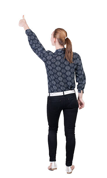 istock Back view of  pointing woman. 513651119