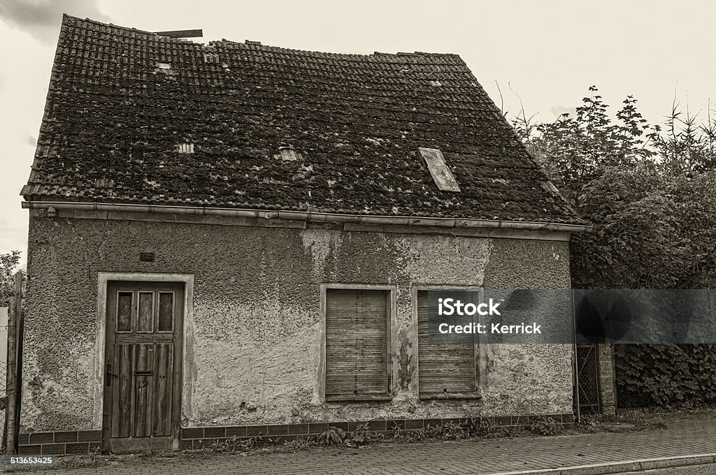 Old abandond house - damaged old small house in a village in Germany. its damaged and abandoned. danger to entry. Abandoned Stock Photo
