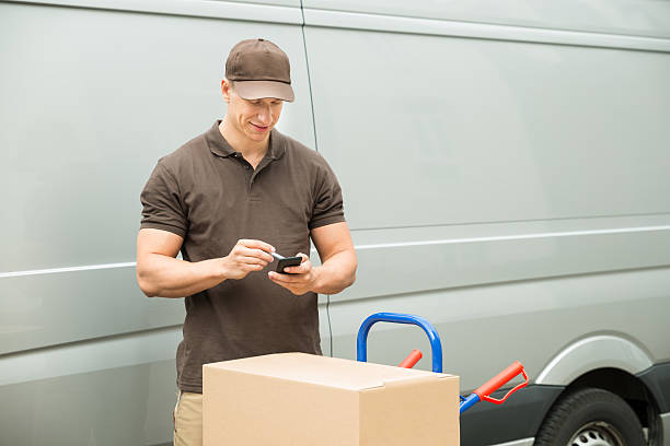 istock Delivery Man Checking List On Mobile Phone 513670984