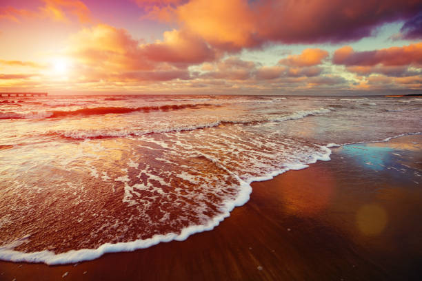 istock Sunset over sea with oncoming waves 513671942