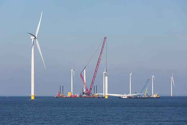 Construction site of offshore wind farm near the Dutch coast Construction site new offshore wind farm near the Dutch coast offshore wind farm stock pictures, royalty-free photos & images