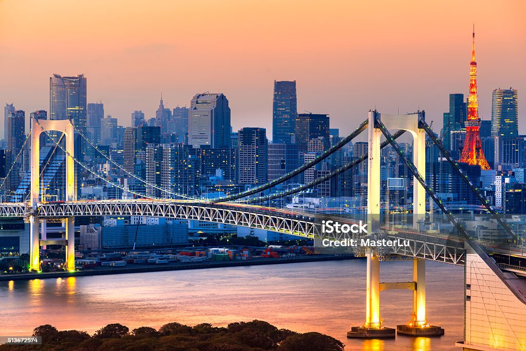 Rainbow Bridge with the Tokyo Tower at sunset, Japan. Rainbow Bridge with the Tokyo Tower at sunset in the Tokyo Bay, Japan. Architecture Stock Photo