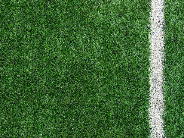 White Stripe Line on The Green Soccer Field Top View White Stripe Line on Artificial Green Soccer Field as Copyspace to input Text from Top View used as Template turf photos stock pictures, royalty-free photos & images