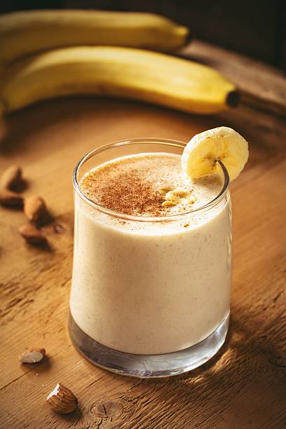 Banana smoothie with peanut butter and cinnamon stock photo