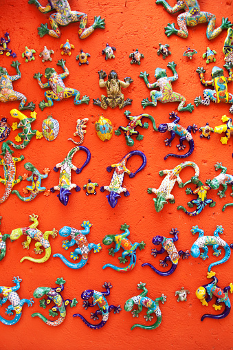 Cancun, Mexico - January 21 2010: A selection of glazed ceramic lizards displaced in a tourist souvenir retail shop in Cancun, Riviera Maya in Mexico.