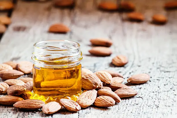 Photo of Sweet Almond Oil, first extraction, in a small glass jar