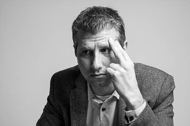 istock pensive attractive businessman portrait looking down 513680998