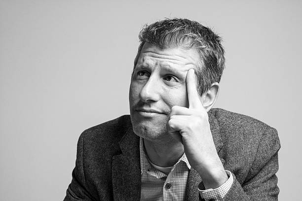 istock pensive attractive businessman portrait looking up 513681476