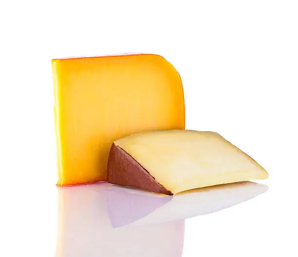 yellow Gouda hard cheese isolated on white background