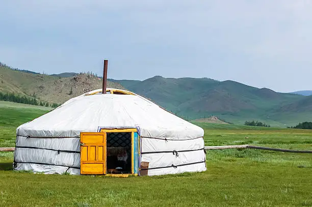 Mongolian yurt called a ger on grassy steppe of northern Mongolia