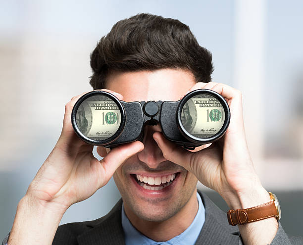 istock Businessman searching for money 513685606