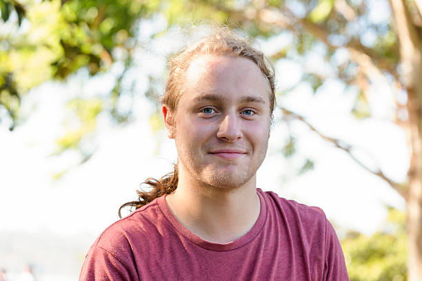 istock Portrait of nineteen years old young man looking at camera 513688116