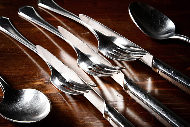 istock old used cutlery  on dark wooden table 513689280