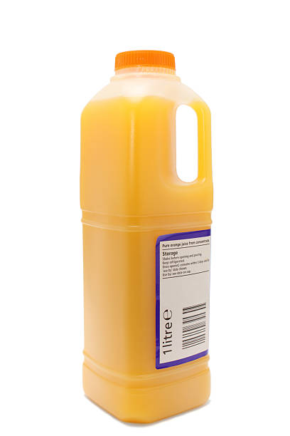 istock transparent plastic one litre orange juice carton 513690792