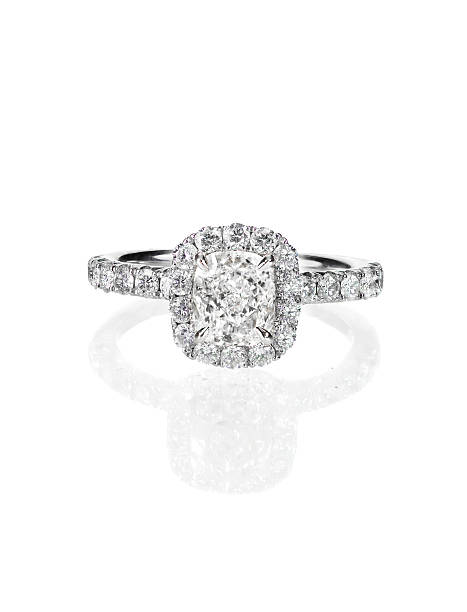 istock engagement wedding ring Diamond solitaire cushion cut halo setting 513691932