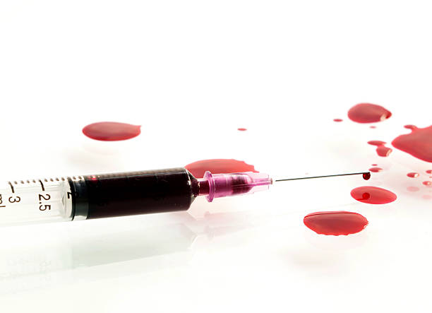 istock Syringe of Red Blood Test Concept Idea on white background. 513692578