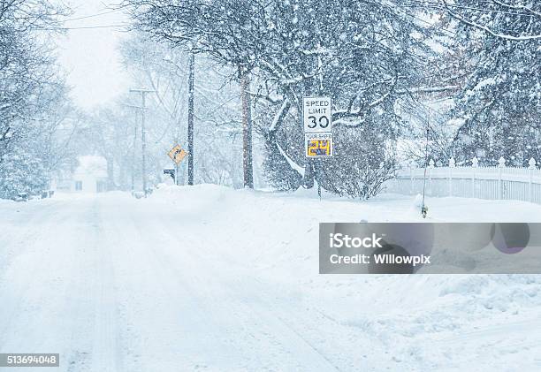 Digital Radar Speed Warning Road Sign In Winter Snow Blizzard Stock Photo - Download Image Now