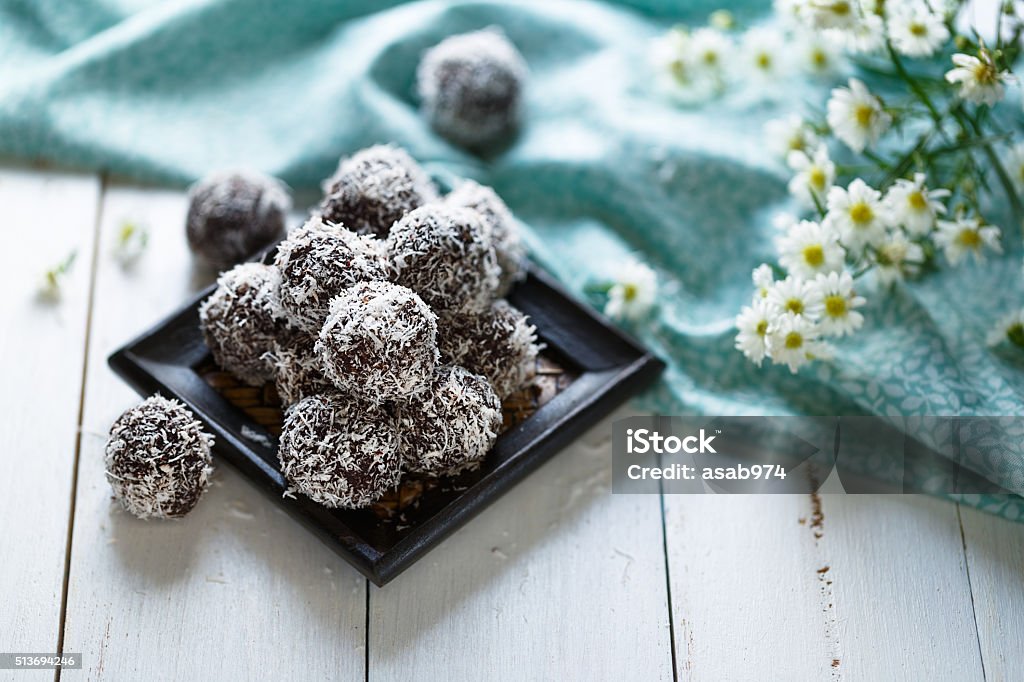Cocoa and coconut energy balls Cocoa and coconut energy balls on white background Sphere Stock Photo