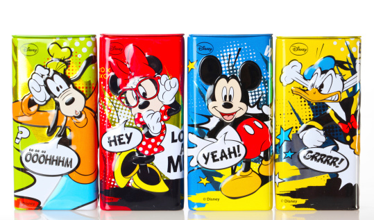 Marbach Germany - September 20, 2014: Set of four Disney figurines on cans filled with choco crunch, distributed by the company IFC Germany GmbH. Studio shot on white background. Re-usable tins.