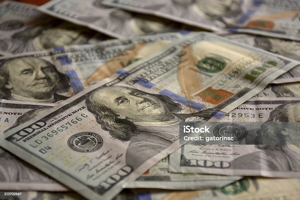 Money A pile of one hundred dollar bills. Abundance Stock Photo