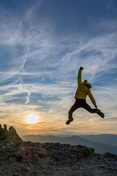istock celebrating success in the sunset 513703299