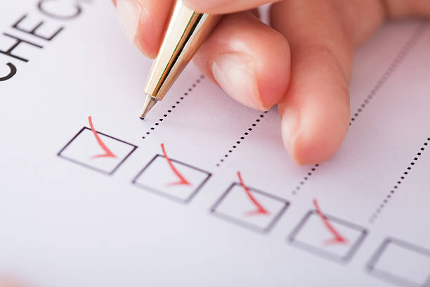 istock Businesswoman Writing On Checklist 513704129
