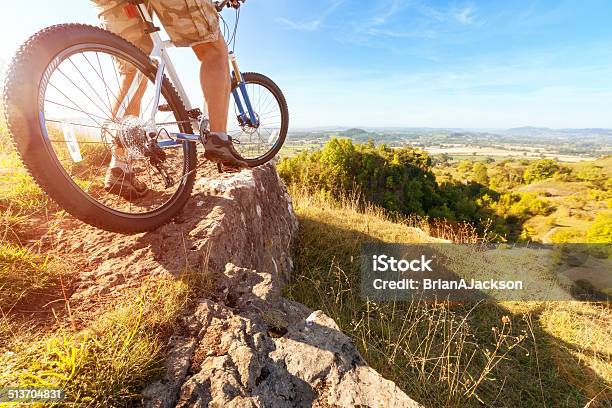 Mountain Biker Looking At Downhill Dirt Track Stock Photo - Download Image Now - Active Lifestyle, Activity, Adult