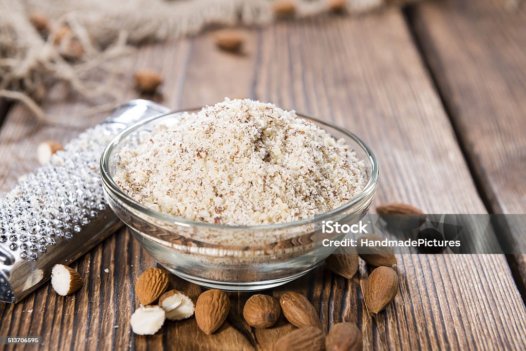 Fresh grated Almonds Fresh grated Almonds (detailed close-up shot) on wooden background Almond Stock Photo