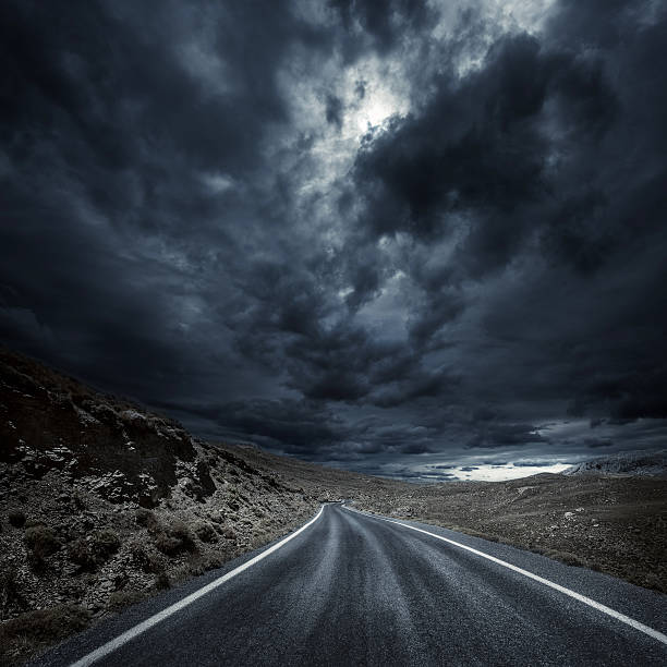 istock Winding road in a mountains at storm 513707187