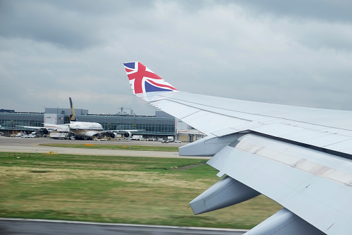 London, United Kingdom - August 26, 2014: Virgin Atlantic trans-Atlantic airplane leaving London's Heathrow airport on a gloomy august day.