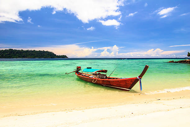 istock Tropical beach with white sand and  long boat 513708637