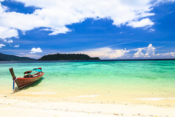 istock Longtail boat and Tropical beach with white sand 513708643