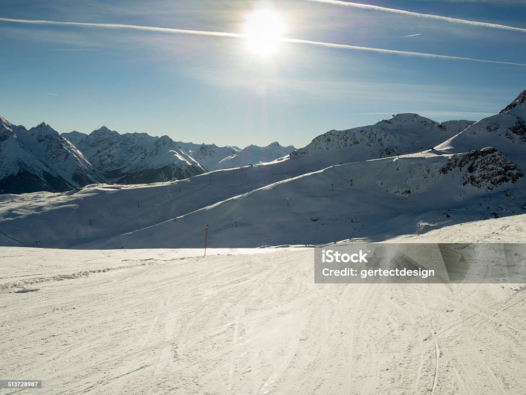 Ski run in the sunlight, Swiss Alps, Engadin Skiing in a high mountain region of the Engadine Winter Stock Photo