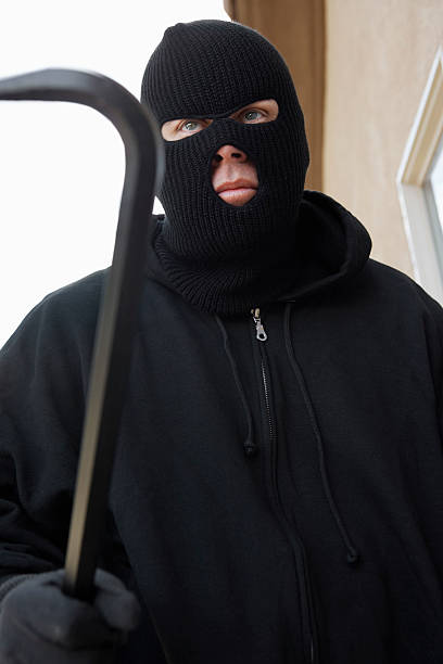 istock Burglar breaking into home 513729323
