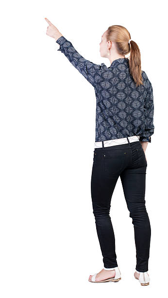 istock Back view of  pointing woman. 513729919