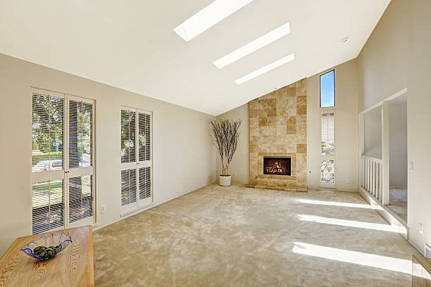 istock Beautitful living room with vaulted ceiling and skylights. Empty 513730419