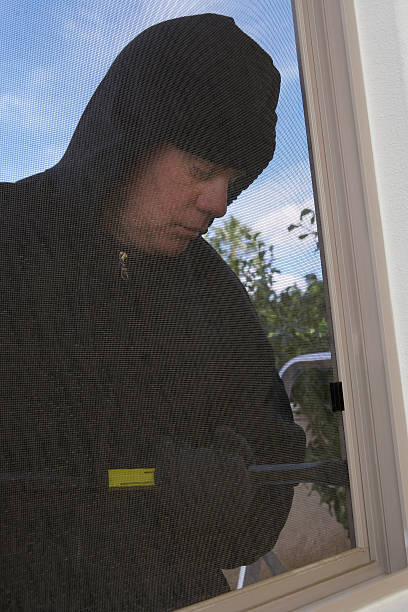 istock Burglar breaking into home 513730575