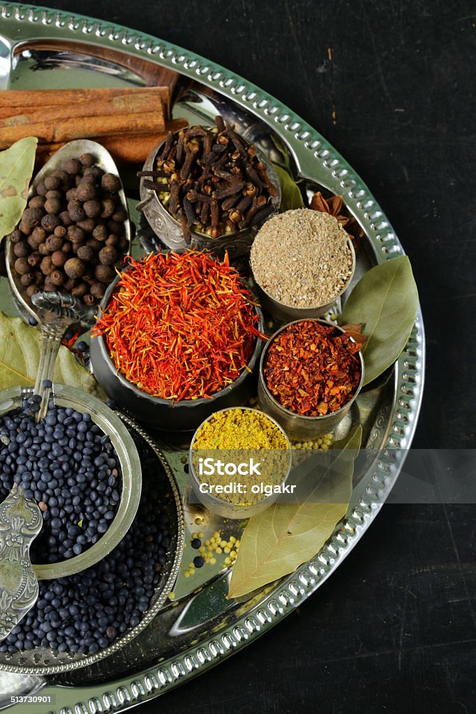 collection of various spices (paprika, turmeric, pepper, aniseed, cinnamon, saffron) Allspice Stock Photo