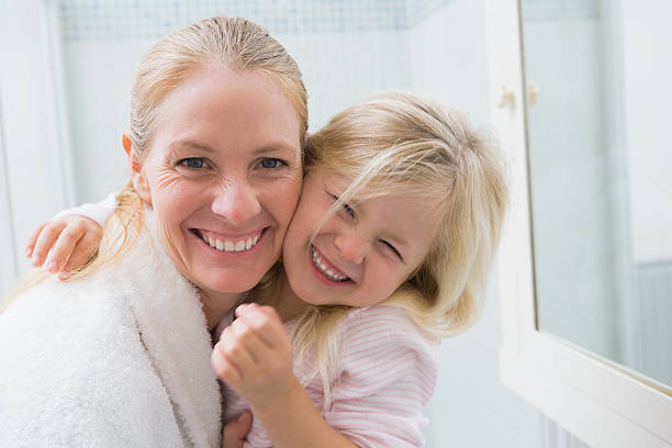 istock Happy mother and daughter smiling at camera 513731995