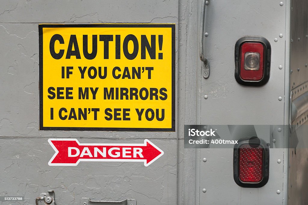 Caution The back of a box truck warning drivers. Pick-up Truck Stock Photo