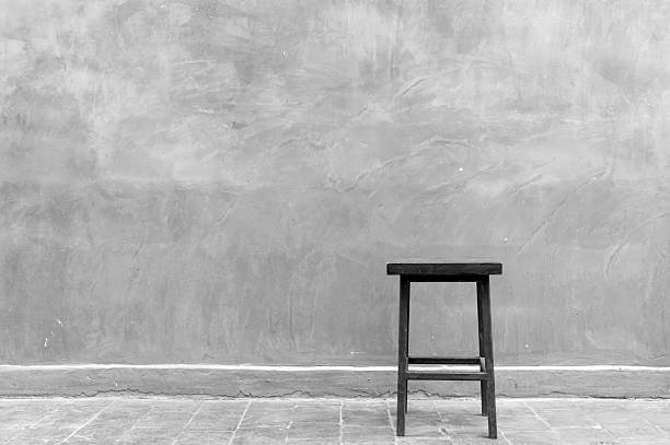 Wall with wooden chairs