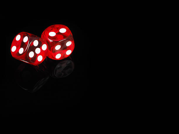 istock Two red casino dices with  reflection . black background 513736912