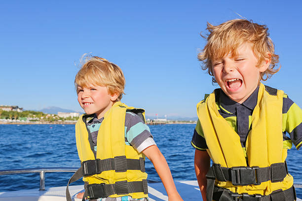 istock two little kid boys enjoying sailing boat trip 513740004