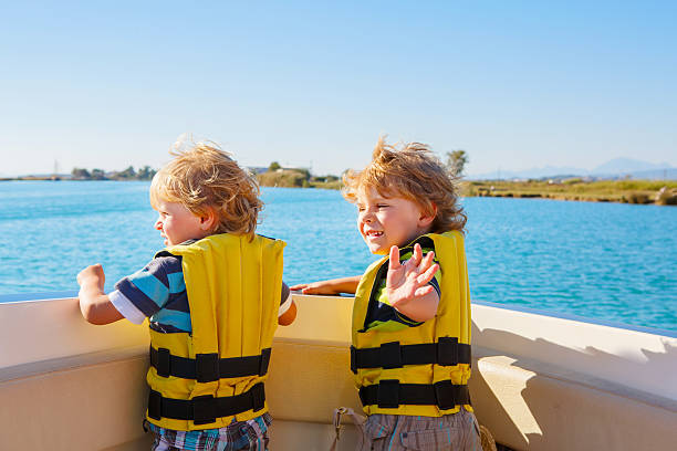 istock two little kid boys enjoying sailing boat trip 513740050