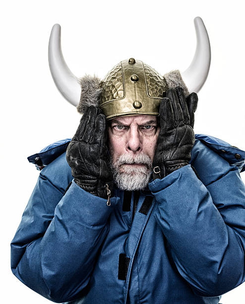 istock Silly Horned Helmet Armor Mock Suspicious Senior Man 513741326